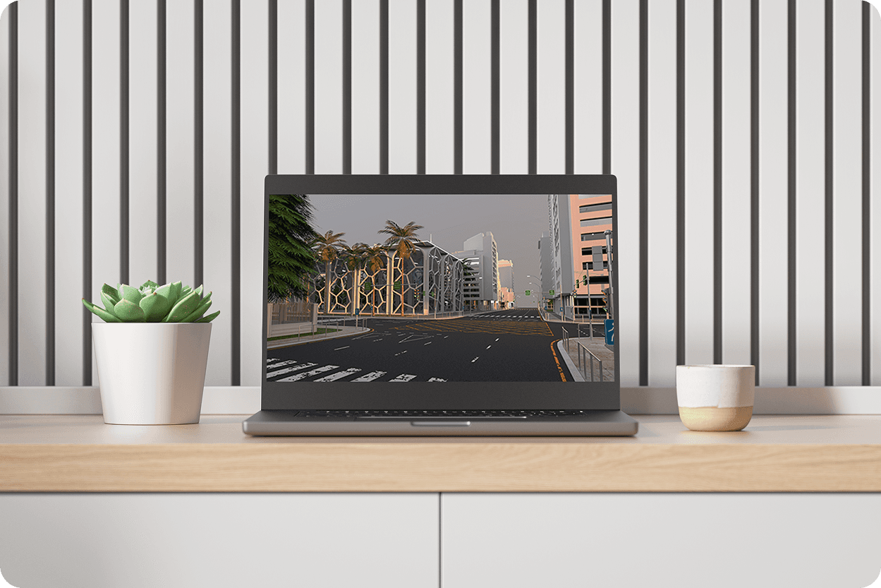 Laptop on white slatted desk showing 3D street-level city environment