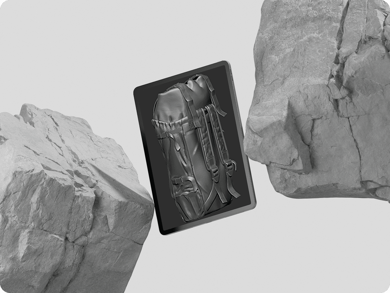 Tablet floating among stone rocks showing detailed 3D alien figure sculpt