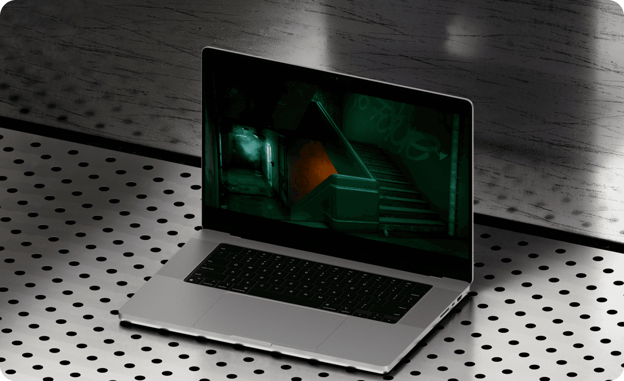 Laptop with cactus showing gothic chandelier ballroom environment angle 2