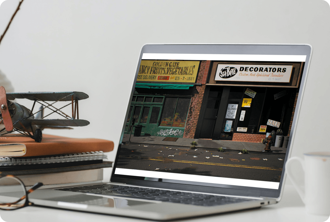 Fan spread of laptops showing white product box 3D assets