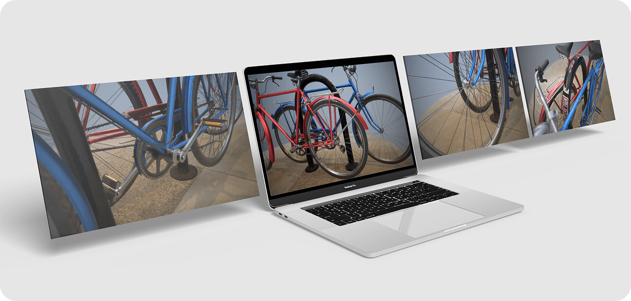 Fan spread of laptops showing geometric crystal diamond 3D assets