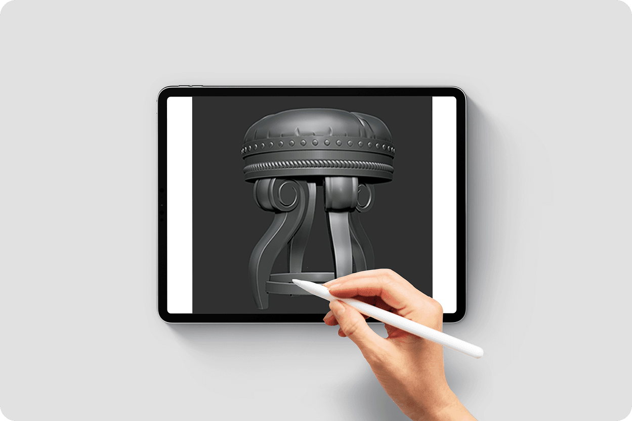 Hand drawing on tablet with Apple Pencil, screen showing 3D headphone model